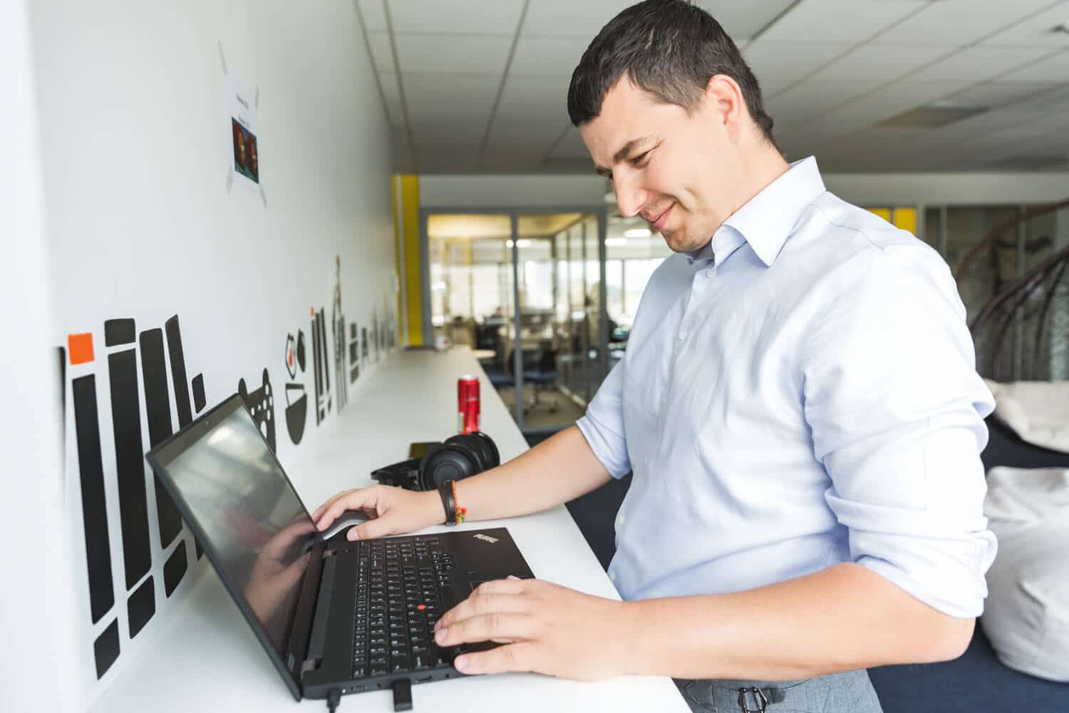 A Zenitech employee using a laptop