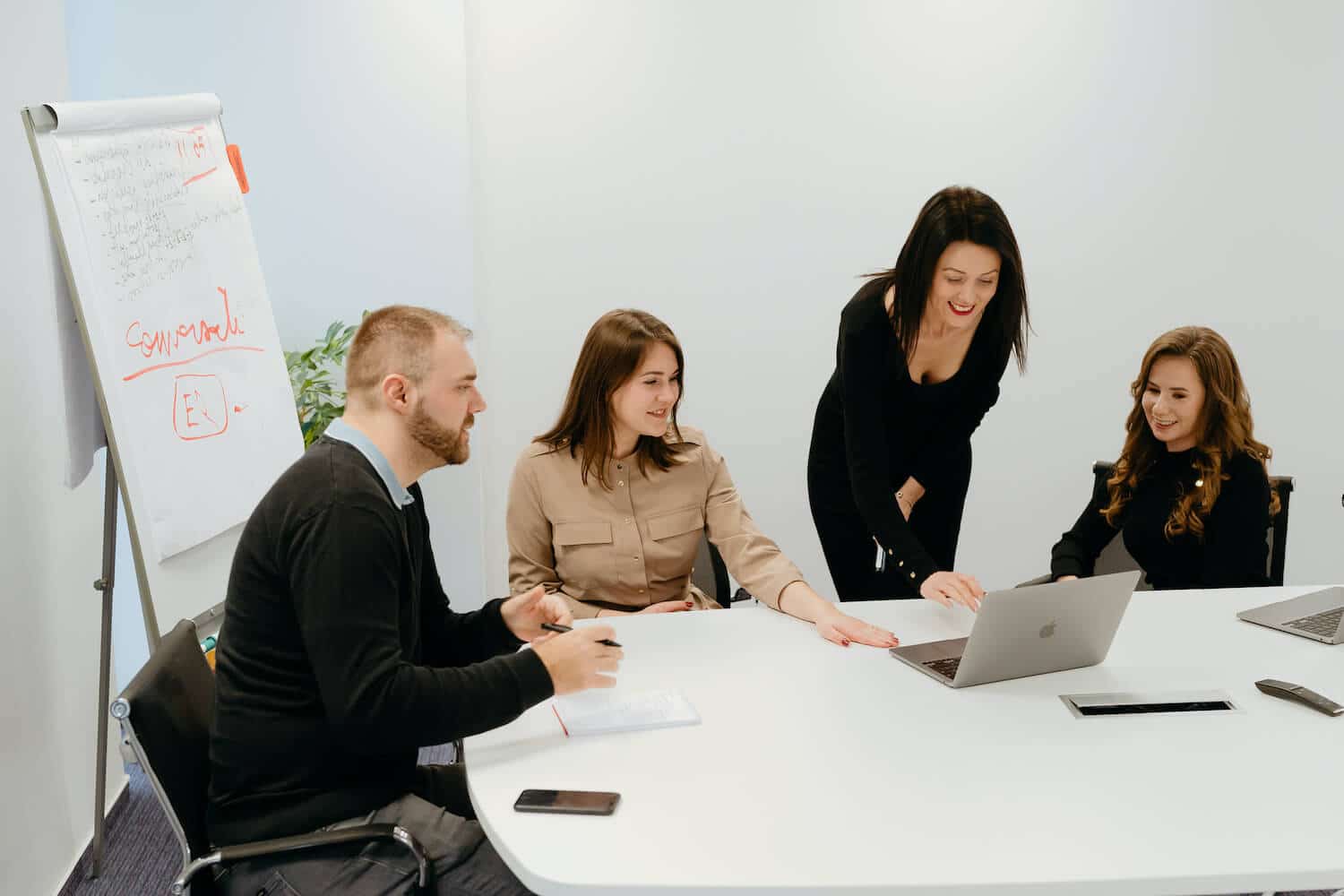 Four Zenitech employees sat in a boardroom