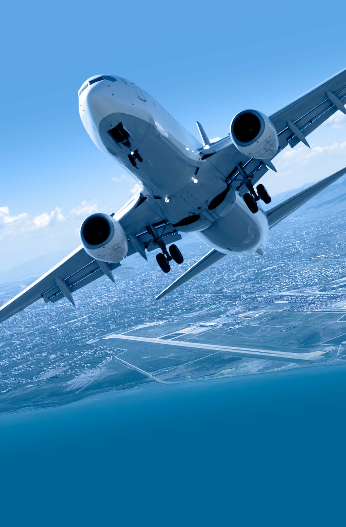 A commercial airplane ascending into the sky after takeoff, viewed from below with a clear blue sky and a cityscape with a runway visible in the background. The image conveys themes of travel, aviation, and global connectivity.