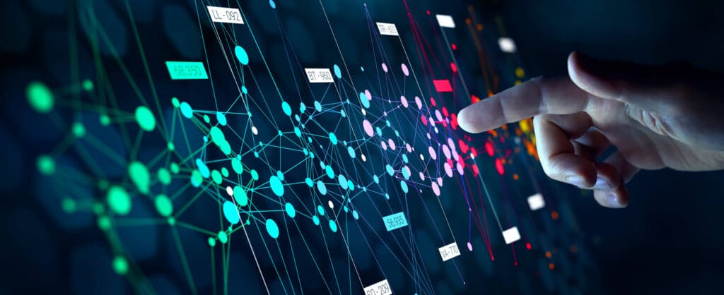 A finger touching a screen showing colourful lines and dots in a network diagram