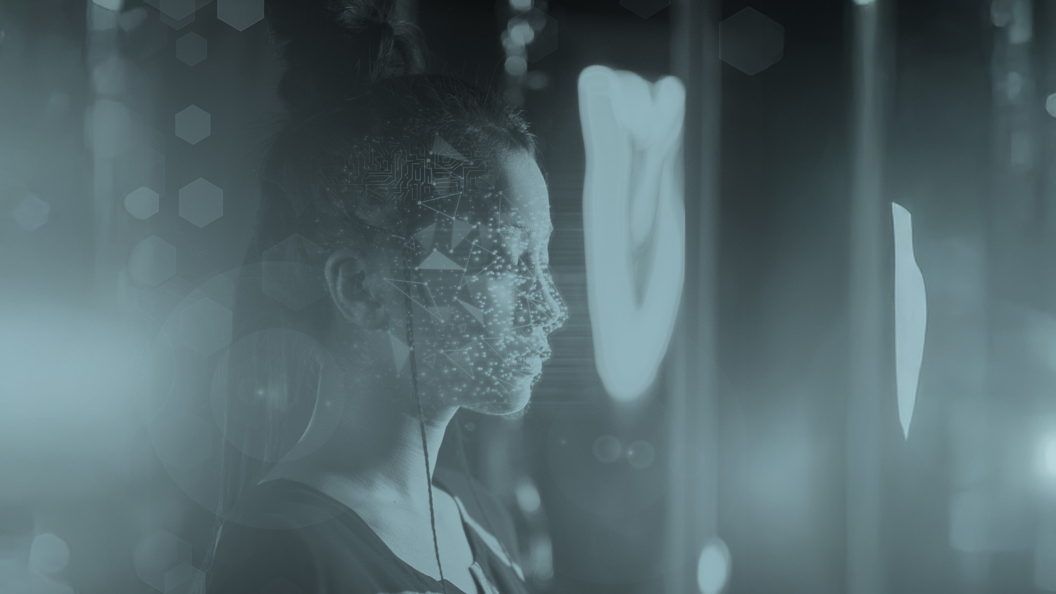 Profile view of a woman’s face overlaid with a digital facial recognition pattern, representing biometric technology and AI.